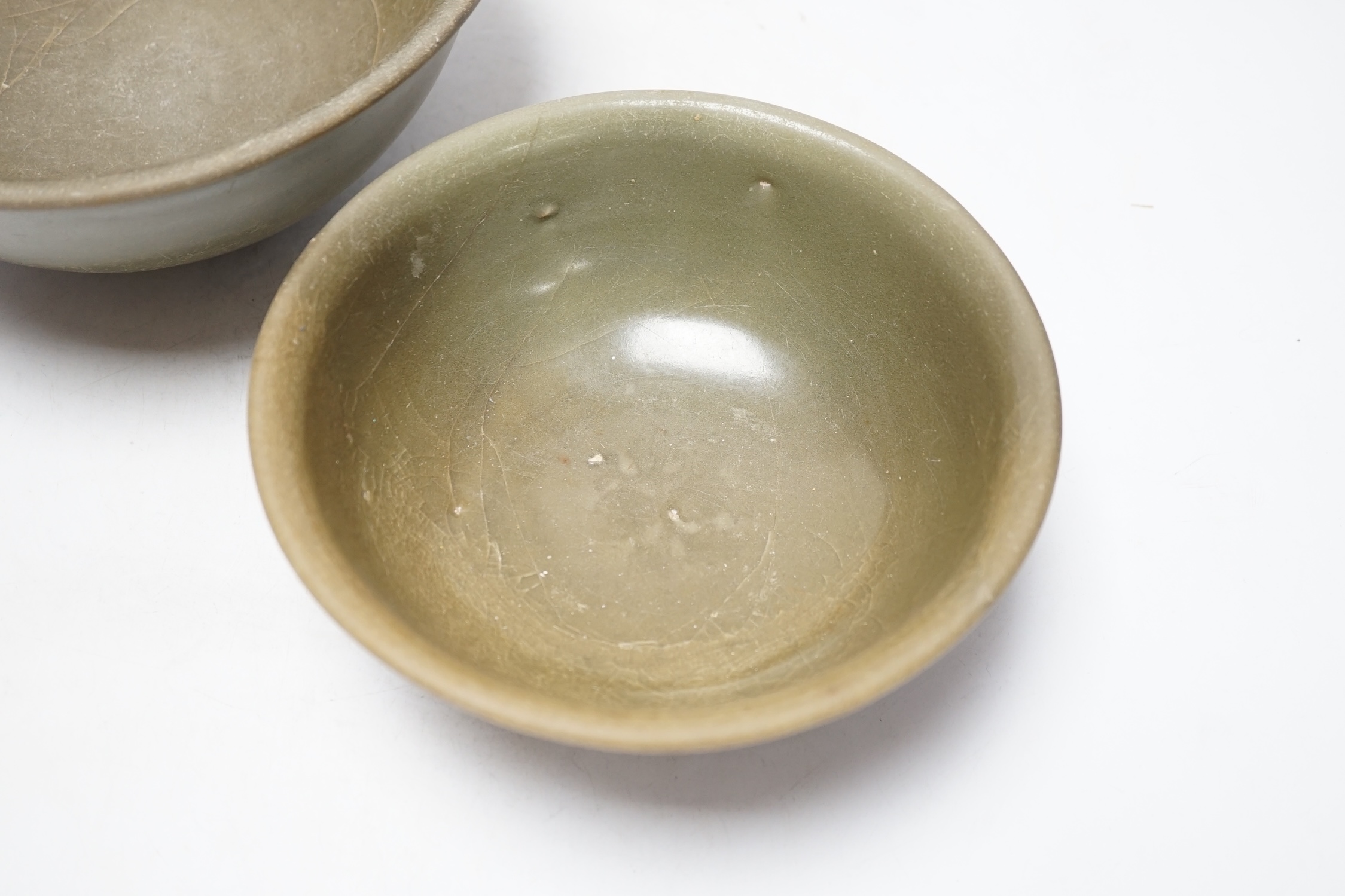 Two Chinese celadon bowls, Yuan-Ming dynasty, largest 22.5cm diameter